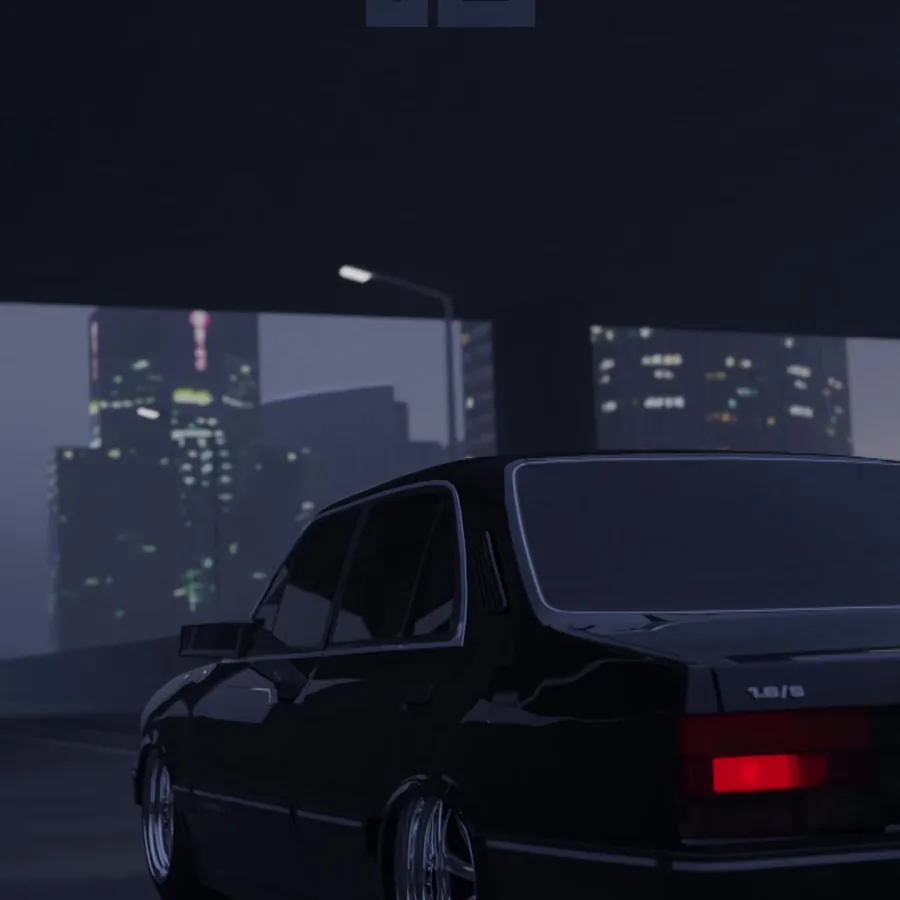 Dark car on a street at night, with the city blurred behind it